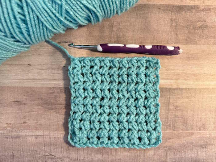 The staggered half-double crochet stitch pairs worked in 100% acrylic yarn