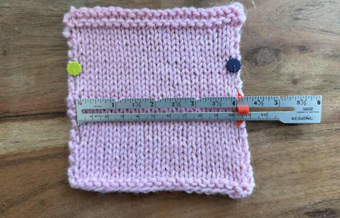 A stockinette stitch swatch with a ruler measuring gauge A stockinette stitch swatch with a ruler measuring gauge