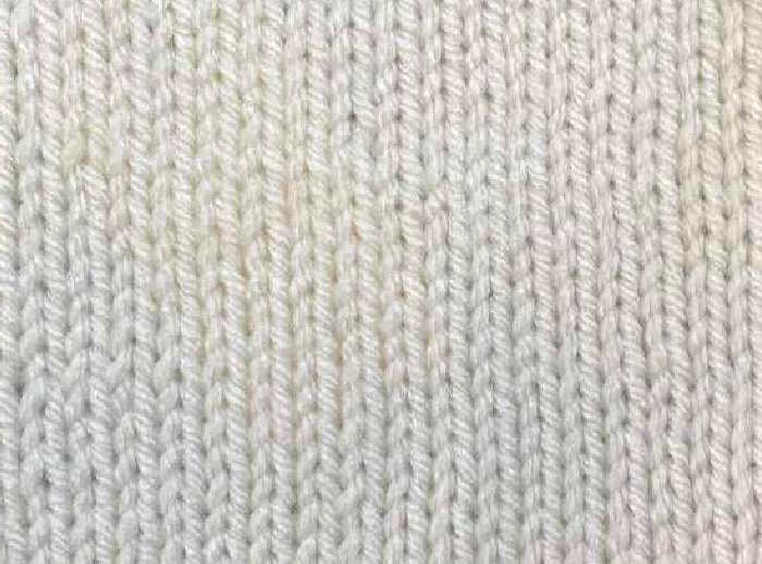 Stockinette Stitch A swatch of stockinette pattern worked in white wool