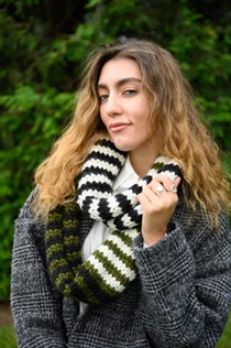 Striped knit cowl modeled by a young woman