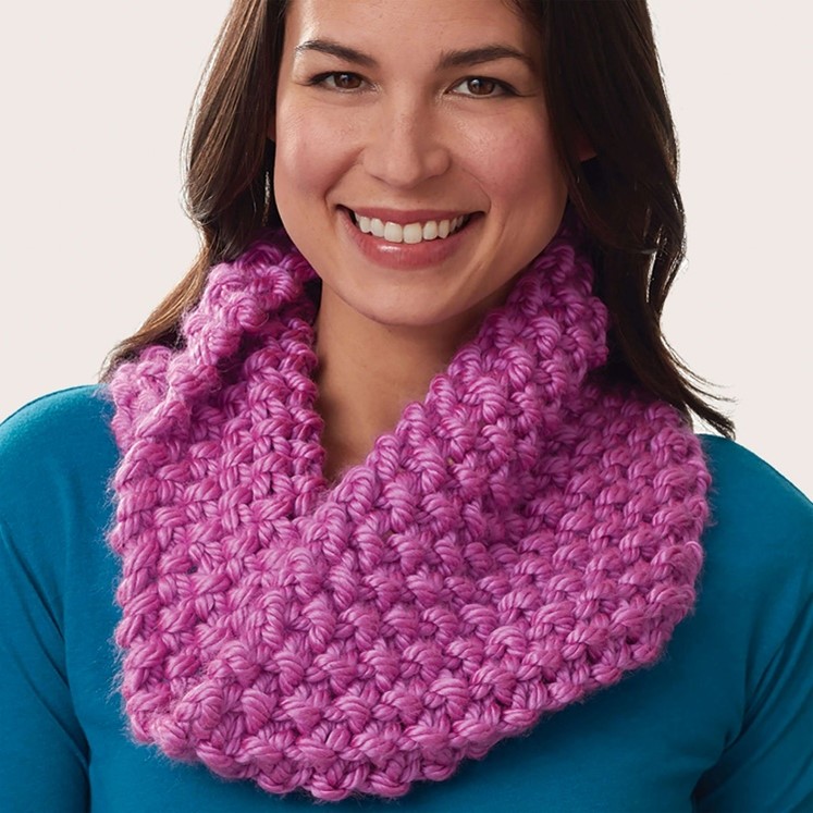 Supersized seed stitch cowl worn by a young woman
