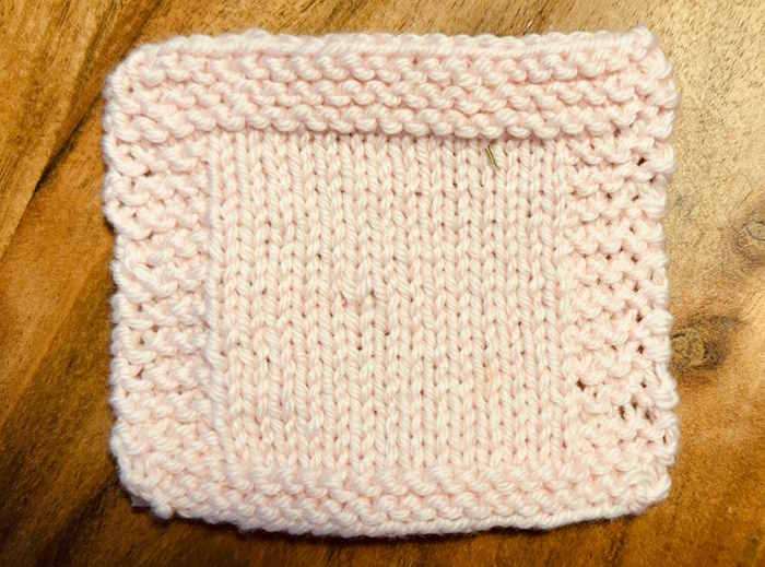 A knitted swatch worked with Cascade Superwash Marino wool