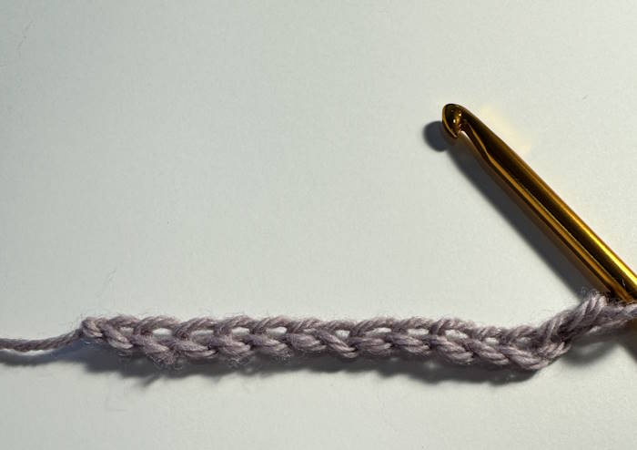 A chain of stitches worked with a tunisian crochet hook