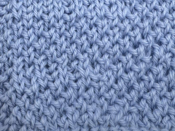 Twisted Moss Stitch swatch worked in blue wool