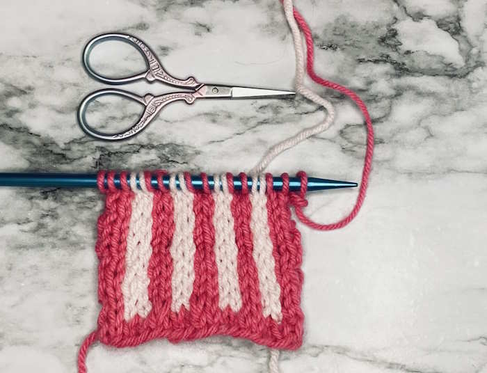 A slip stitch design that creates vertical stripes worked in acrylic yarn