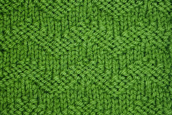 The waved welt knit stitch worked in green