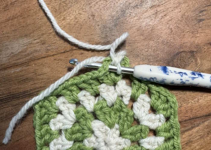 A Granny swatch showing how to weave in ends as you go.