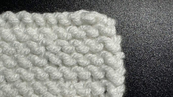 How to weave in ends in garter stitch pattern shown on the right side which is invisible