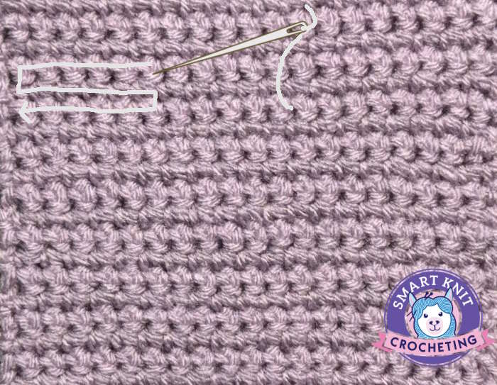 A swatch of single crochet stitches with the direction of the weaving in ends