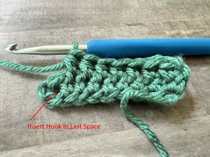 Swatch of wide half double crochet showing where to place the hook in the last stitch in the row.