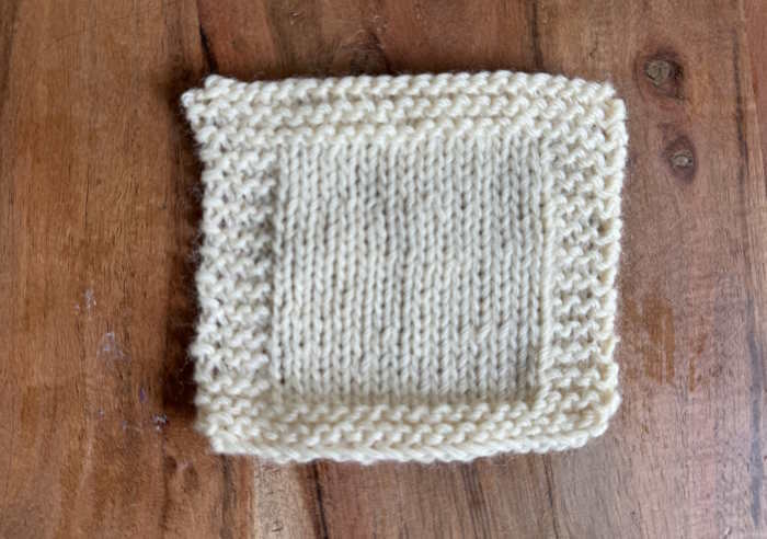 A swatch is shown in Wool of the Andes yarn in color white A swatch is shown in Wool of the Andes yarn in color white