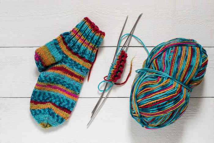 A pair of wool knitted mittens using varigated yarn A pair of wool knitted mittens using varigated yarn