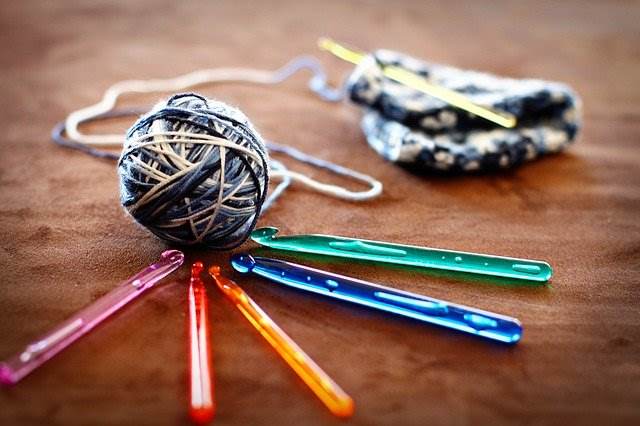 Crochet hooks with colorful yarn skeins