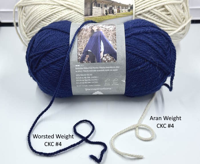 Two worsted weight yarns, one marked as Aran weight