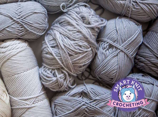 Assortment of yarn types and colors arranged for comparison