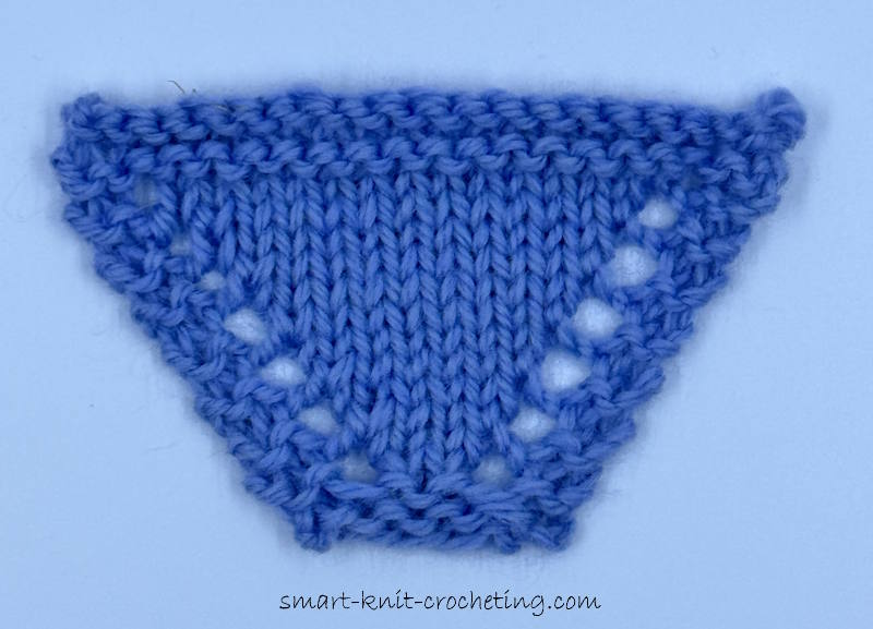 Small Swatch of yarn over worked in blue yarn