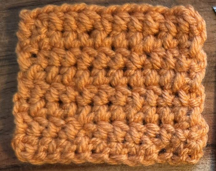Tight, twisted texture formed by yarn-under half double crochet stitches.