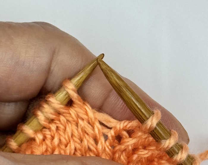 A yarnover between two knit stitches, step one.