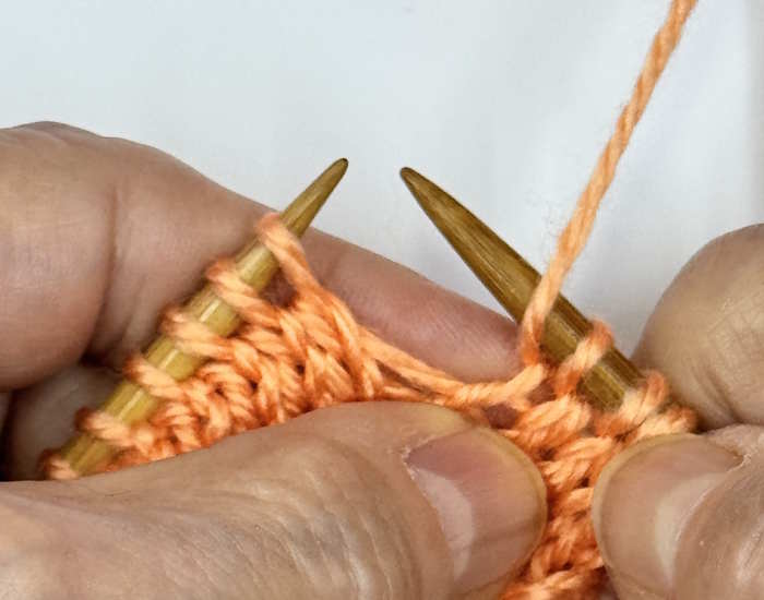 A yarnover between two knit stitches, step 2