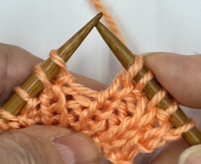 A yarnover made between a knit and purl stitch, step 2