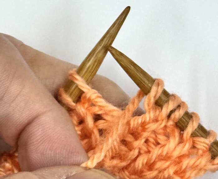 A yarnover created between a knit and purl stitch, step 2