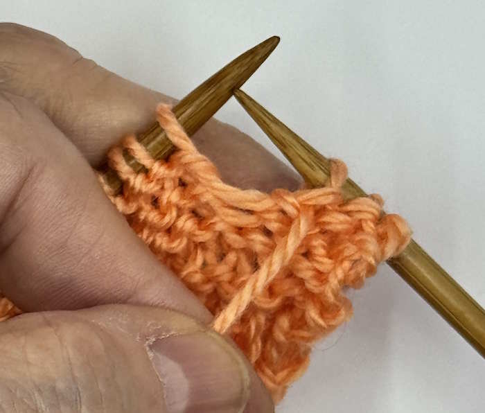 A yarnover between two purl stitches